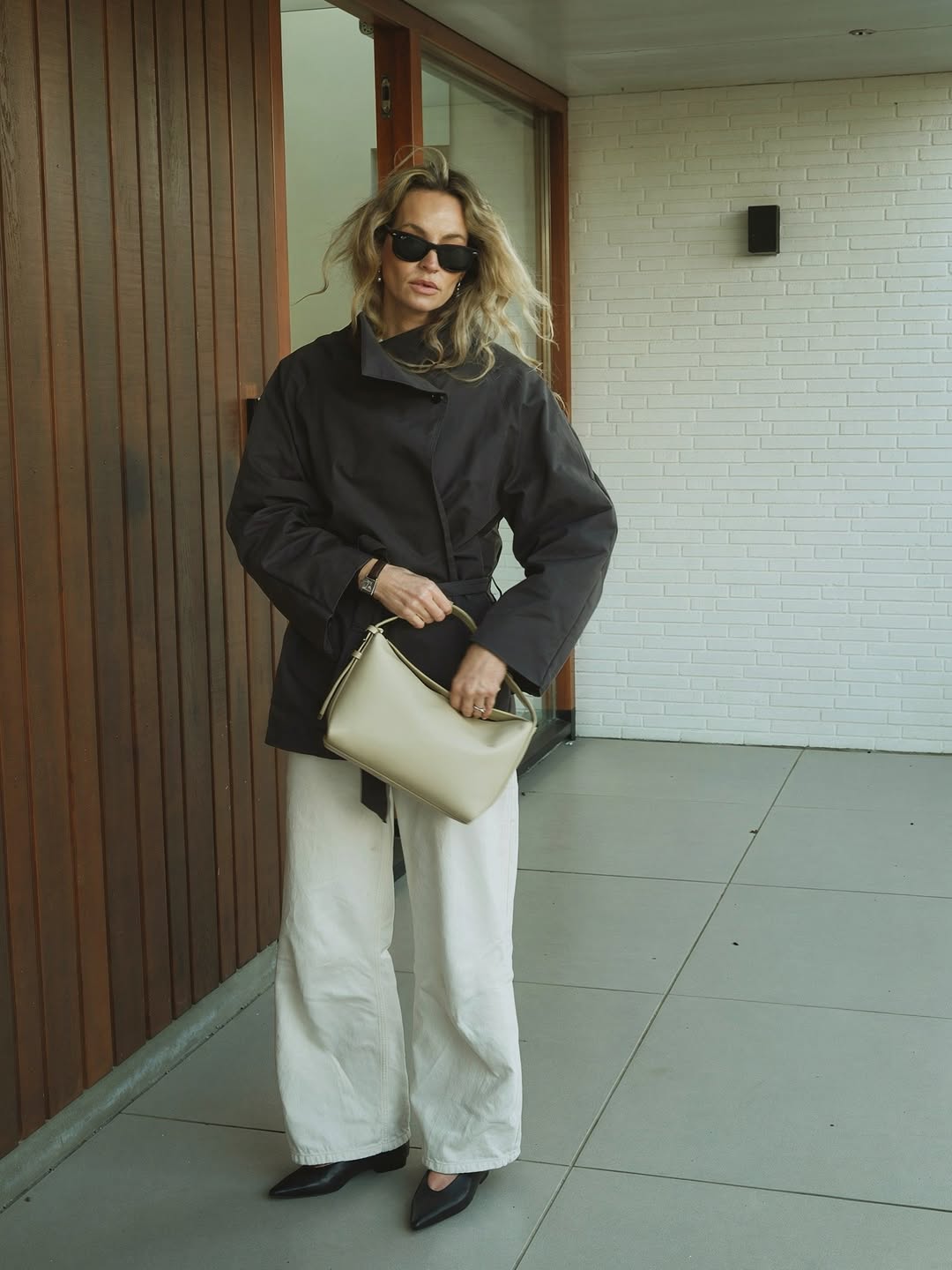 Anouk in jacket and white jeans