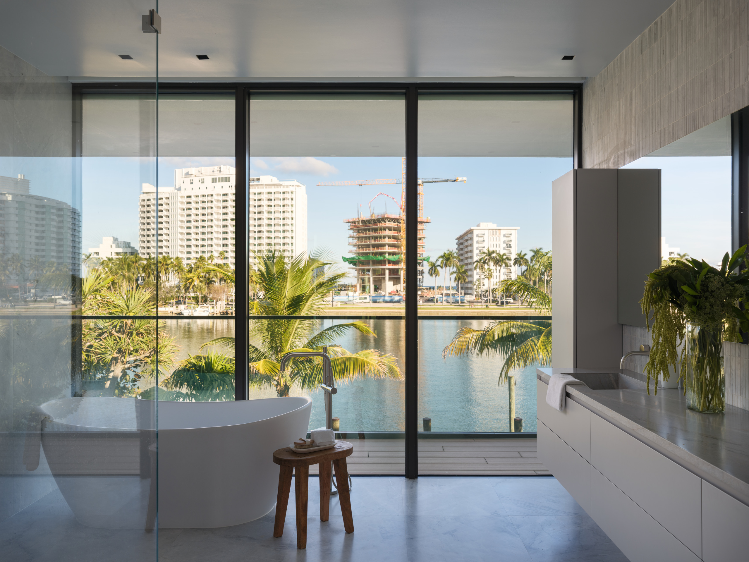 The bathroom in the principal suite has waterfront views