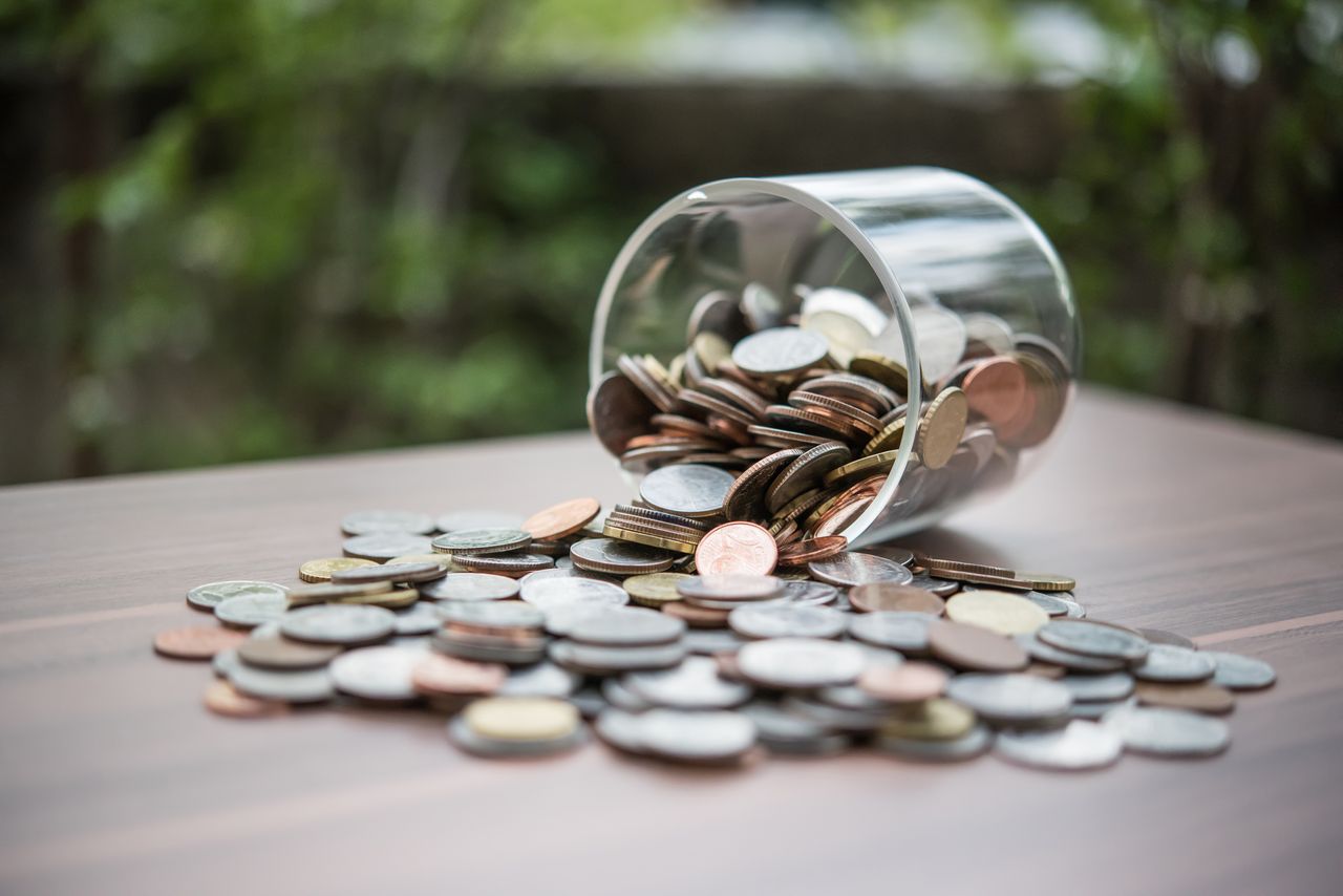 Save money for investment concept coin baht thai in the glass jar,Romania