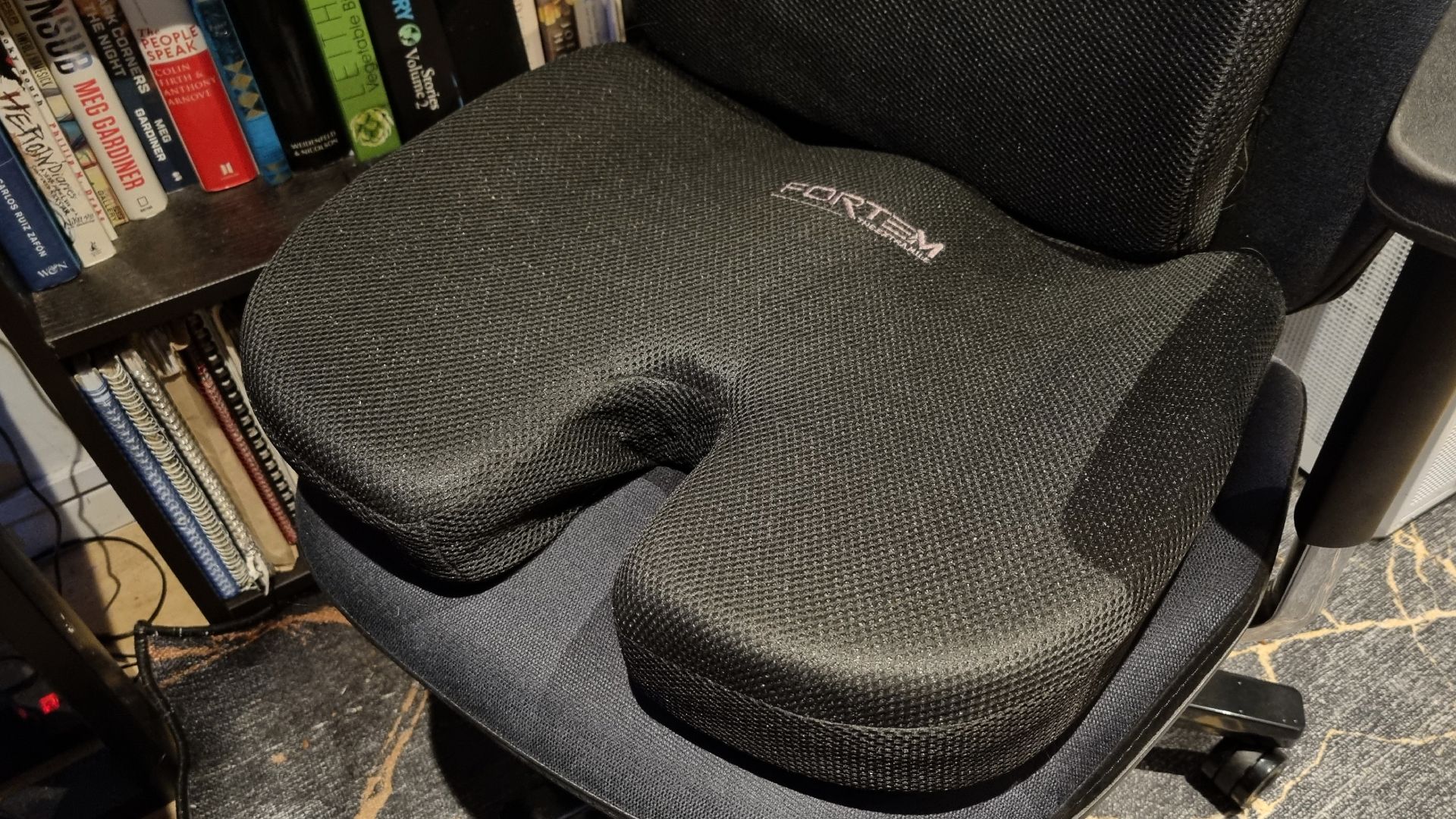 A Fortem memory foam cushion on a gaming chair
