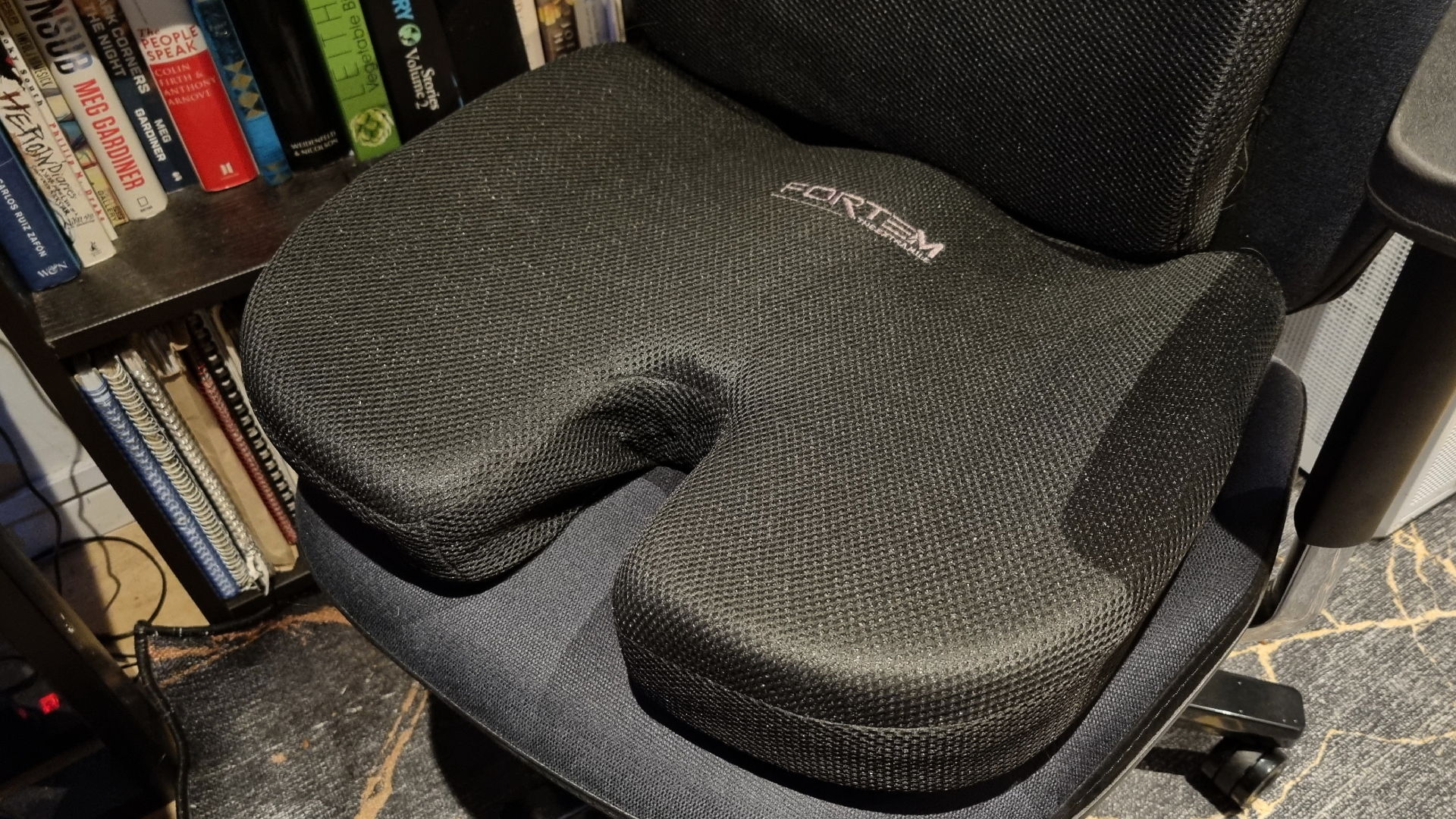 A Fortem memory foam cushion on a gaming chair
