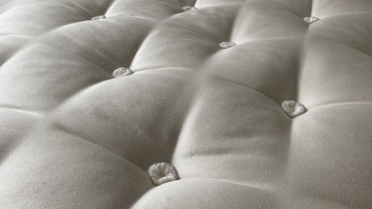The tufted surface of the Simba Earth Escape mattress