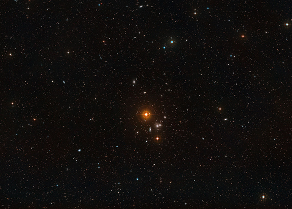 This image shows a wide field of view around the overlapping galaxy pair NGC 3314 140 million light-years from Earth in the constellation Hydra. The two galaxies look like they are colliding but it a trick of perspective. Released June 14, 2012.