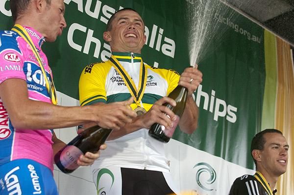 Race winner Simon Gerrans releases the champers on the podium in Buninyong.