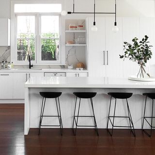 contemporary kitchen with white scheme and marble splashback by meir australia