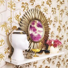 shelf on wall and luxe printed wallpaper and sunglass