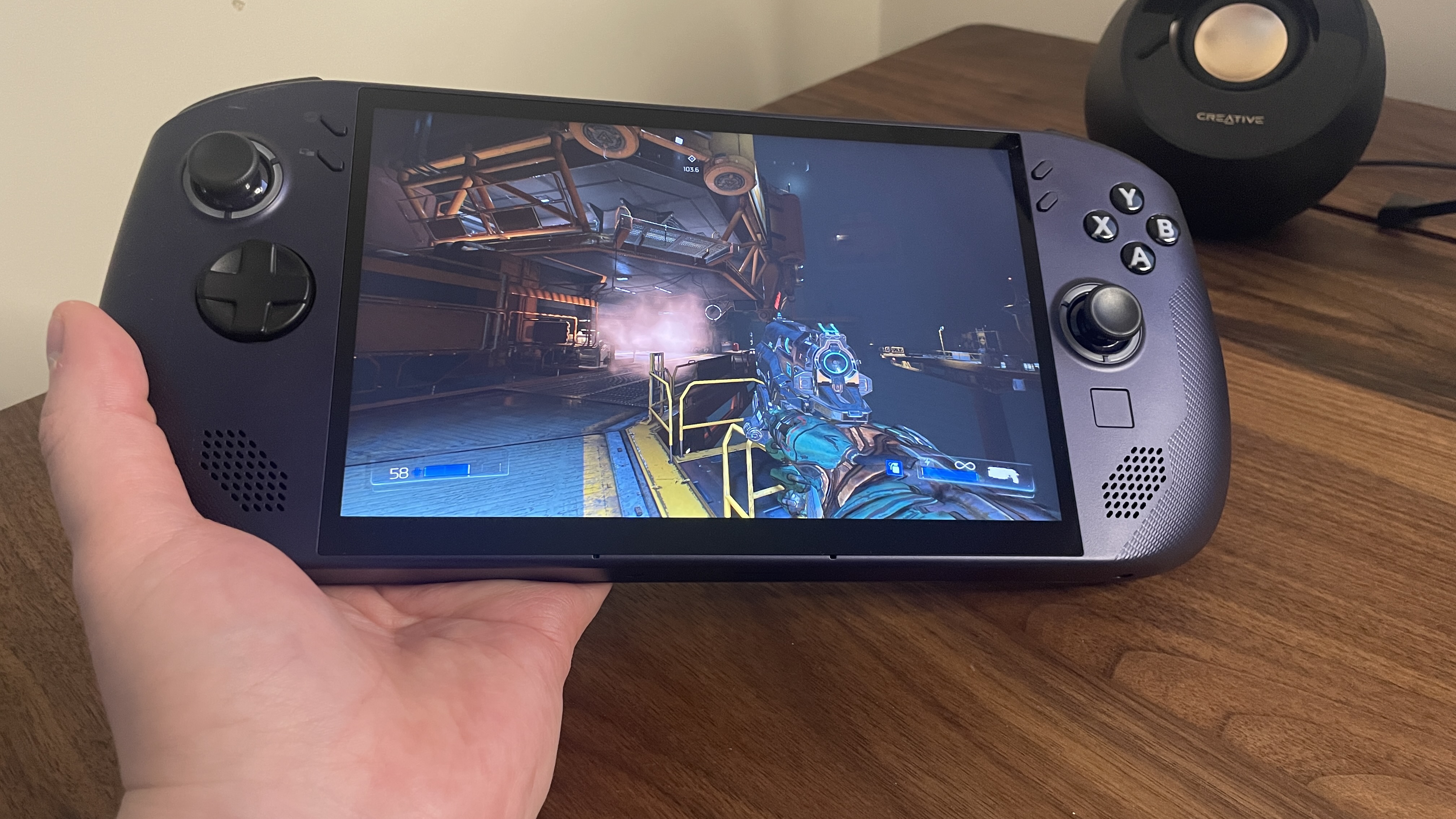 A Lenovo Legion Go S handheld with SteamOS in Nebula Nocturne colour scheme