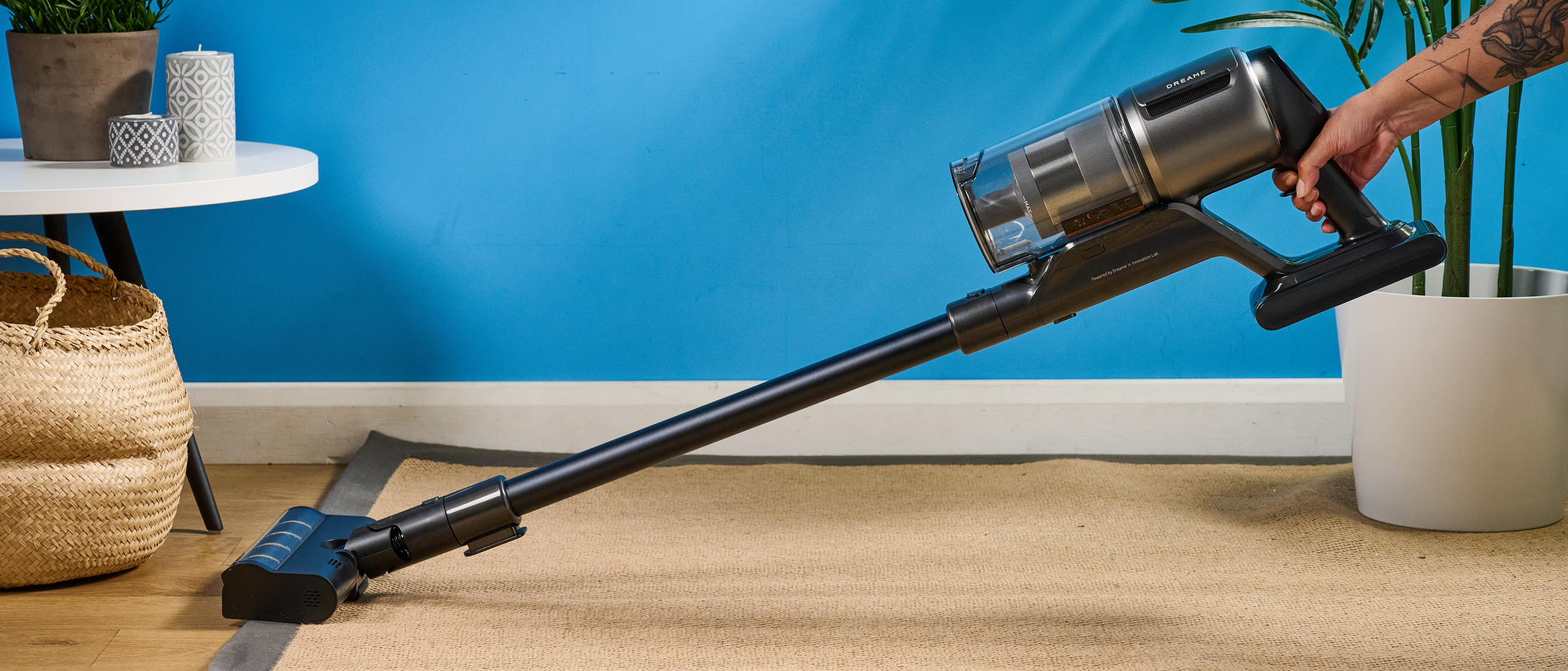 The Dreame Z30 in hand being used to vacuum