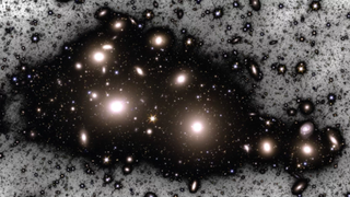 A manipulated image of the Perseus cluster showing the two brightest galaxies brightest galaxies in the cluster, NGC 1275 (left) and NGC 1272 (right),