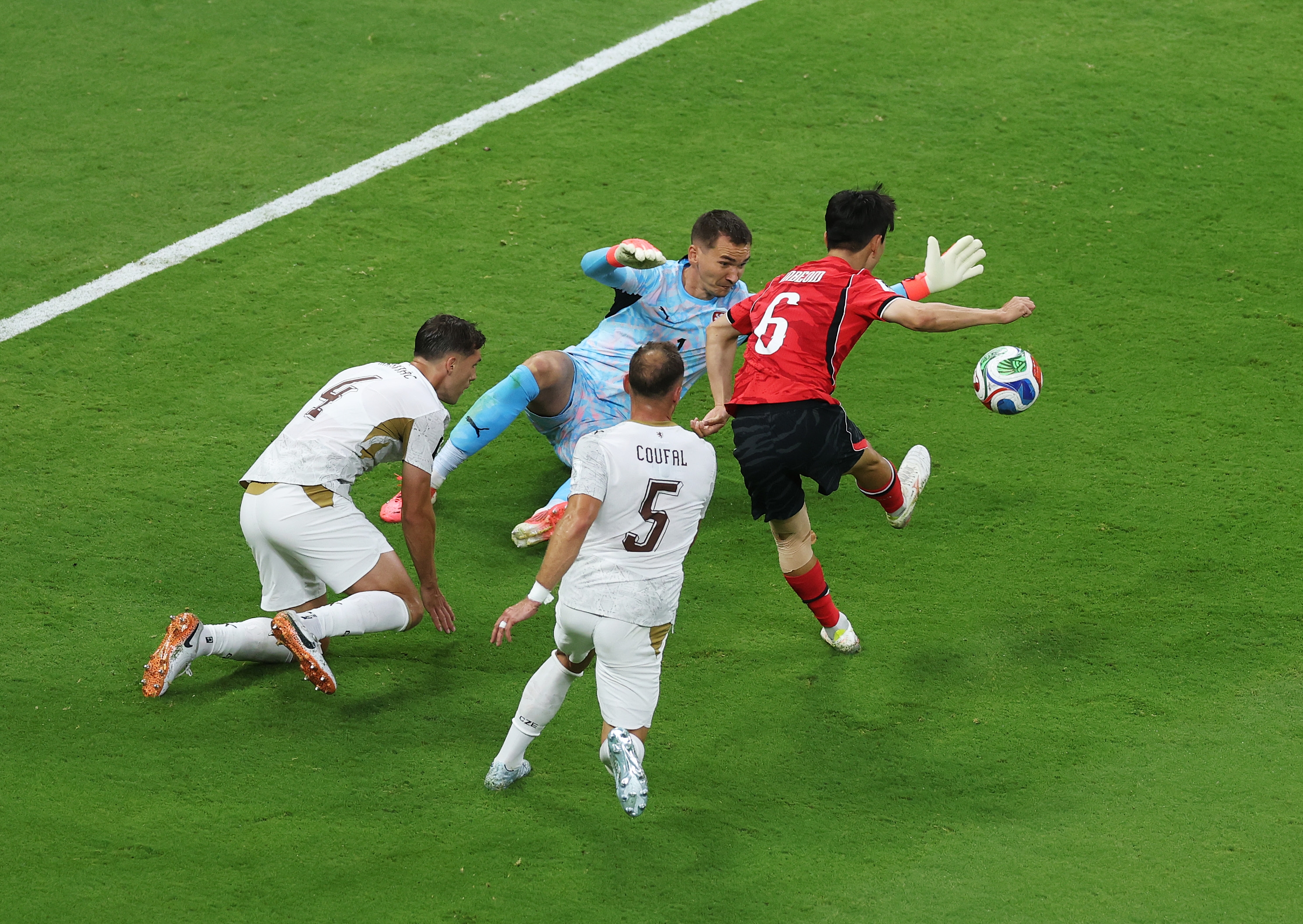 In-Beom Hwang #6 of Korea Republic scores his team's first goal past Matej Kovar #1 of Czechia during the FIFA World Cup 2026 Group A match