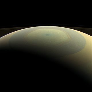 The globe of Saturn, seen here in natural color, is reminiscent of a holiday ornament in this wide-angle view from NASA's Cassini spacecraft.