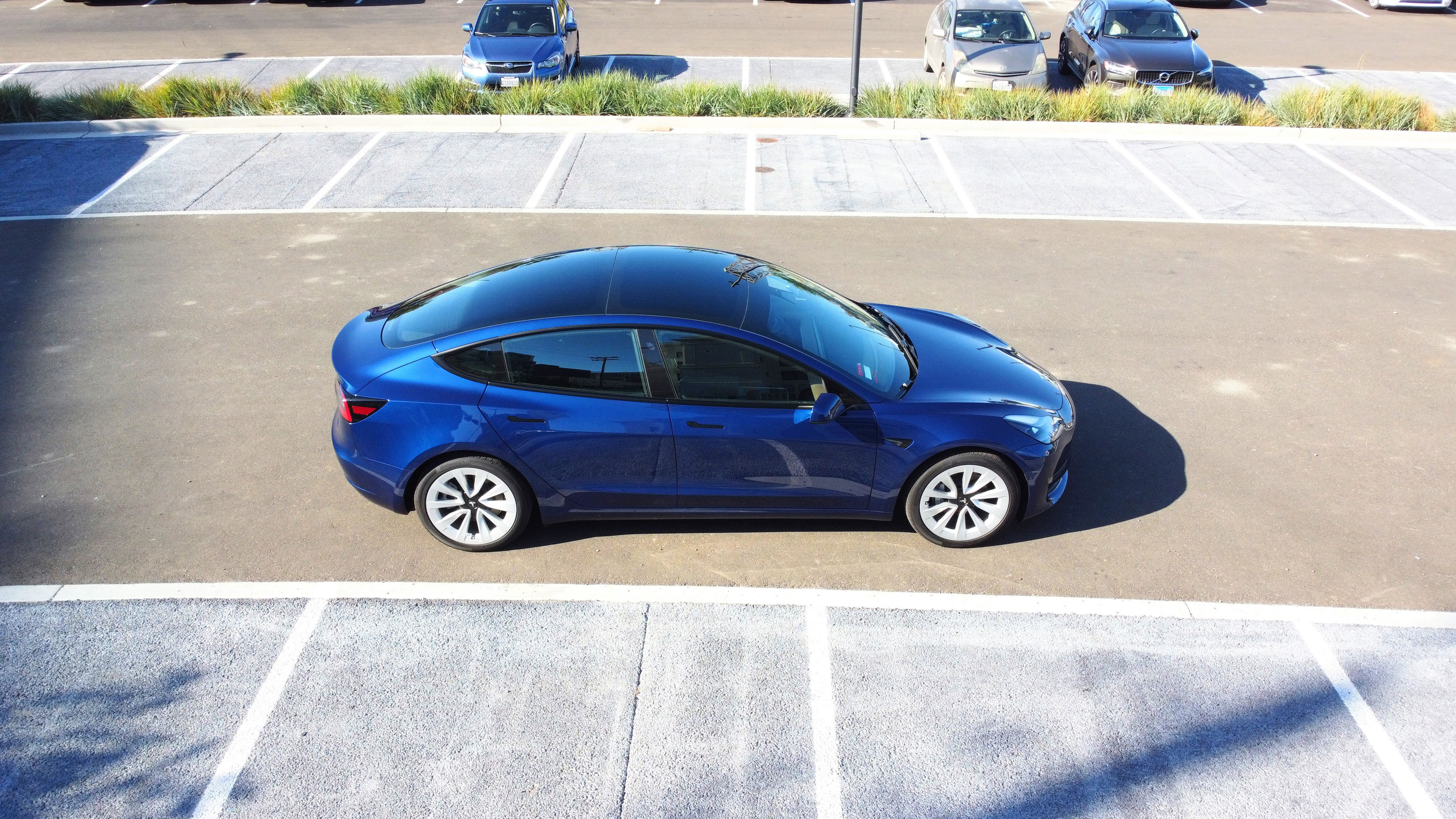 Side view of the Tesla Model 3 in a parking lot