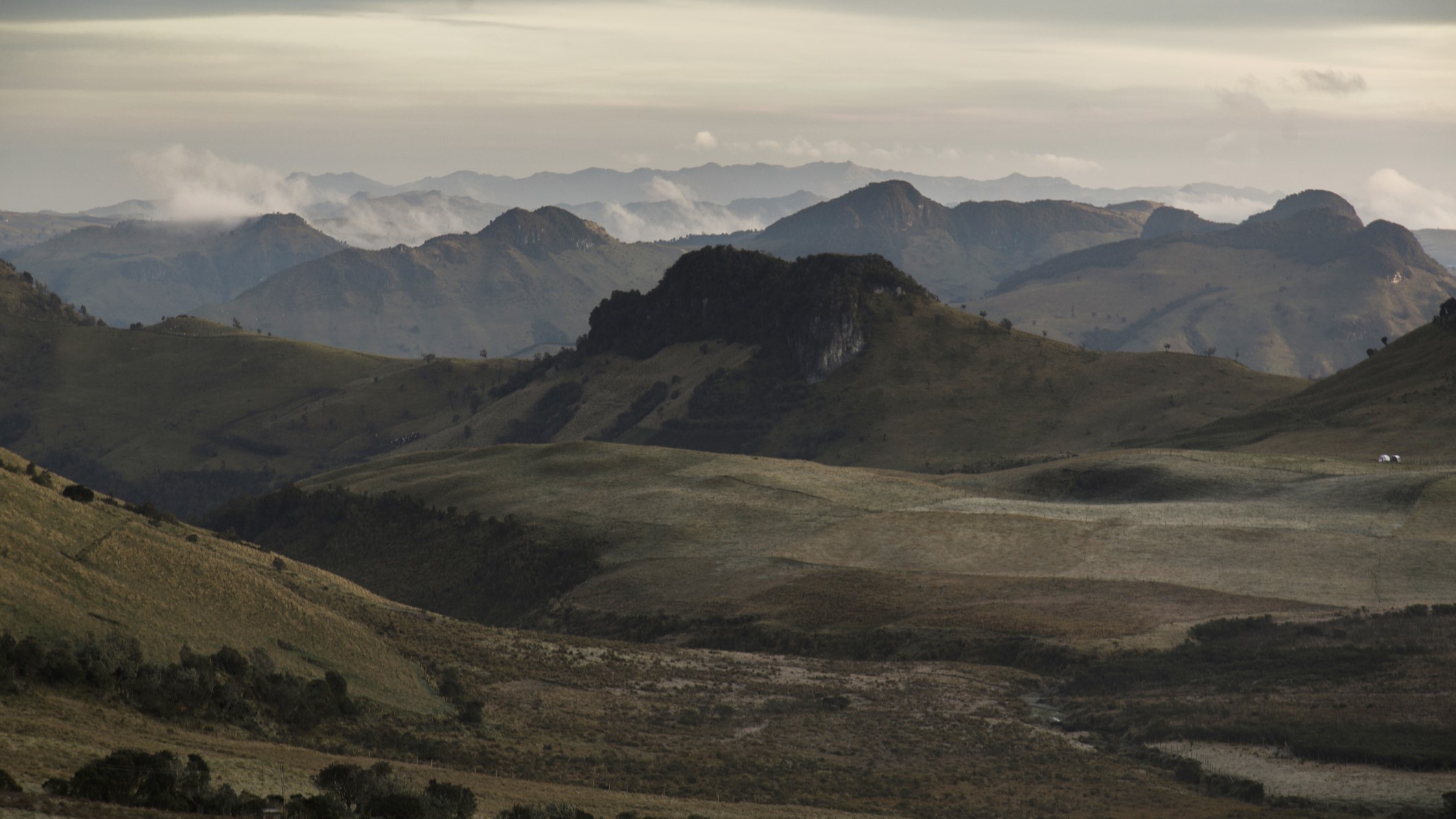 A landscape of the Sierra Nevada de Santa Marta mountain range from a distance.