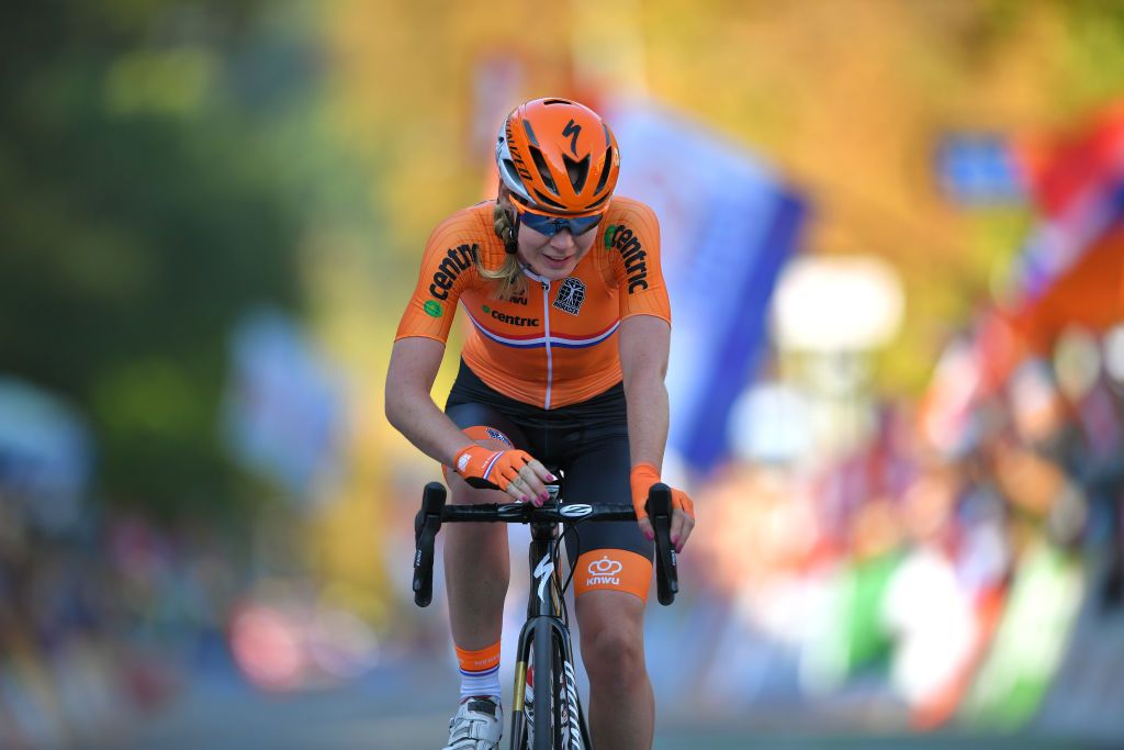 Anna van der Breggen (Netherlands) takes the time to stop her computer before saluting