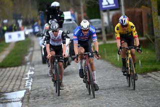 HARELBEKE BELGIUM MARCH 24 LR Tadej Pogaar of Slovenia and UAE Team Emirates Mathieu Van Der Poel of The Netherlands and Team AlpecinDeceuninck and Wout Van Aert of Belgium and Team JumboVisma compete in the breakaway during the 66th E3 Saxo Bank Classic Harelbeke 2023 a 2041km one day race from Harelbeke to Harelbeke on UCIWT March 24 2023 in Harelbeke Belgium Photo by Tim de WaeleGetty Images