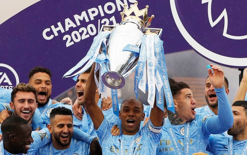 Fernandinho lifts the Premier League trophy for Manchester City