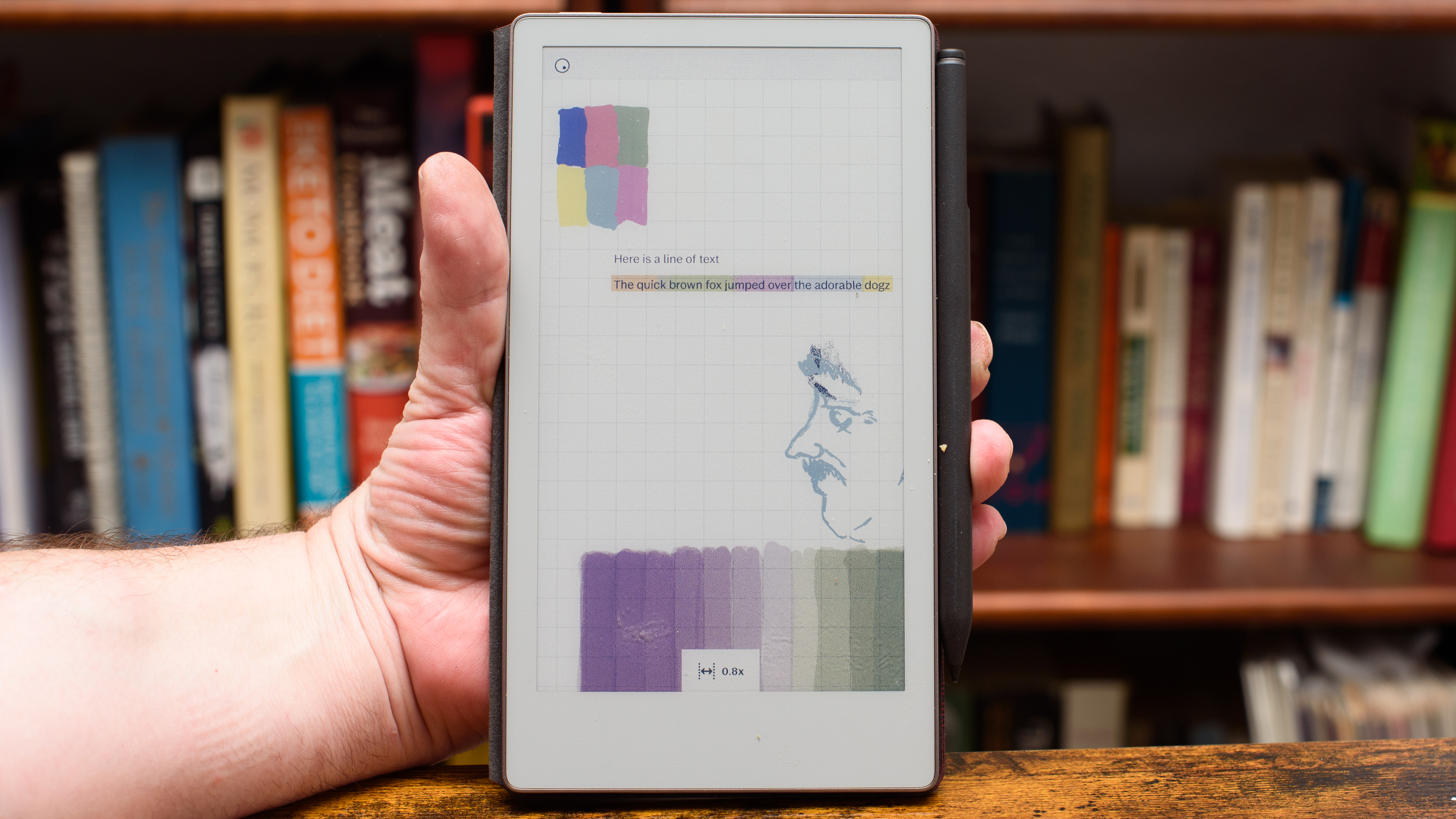 reMarkable Paper Pro Move tablet in front of a library of books, showing various writing screens and comparing the size to a Moleskine notebook