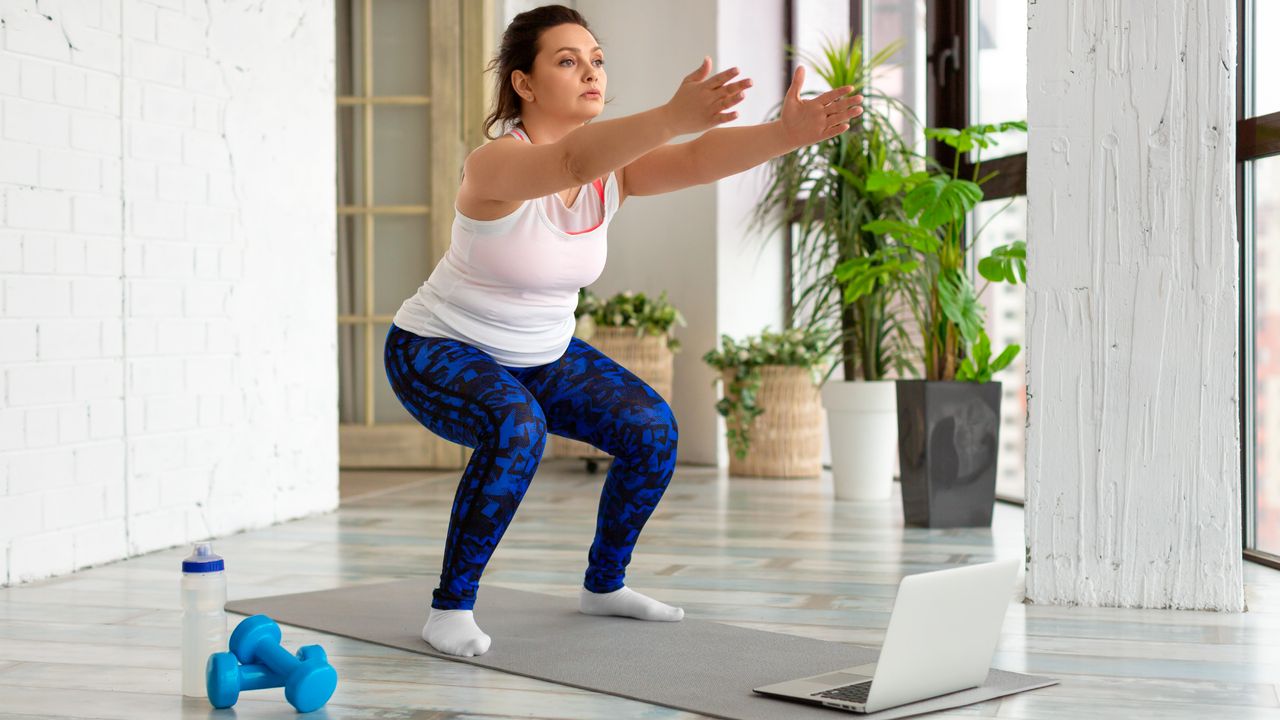 Woman holding a bodyweight squat