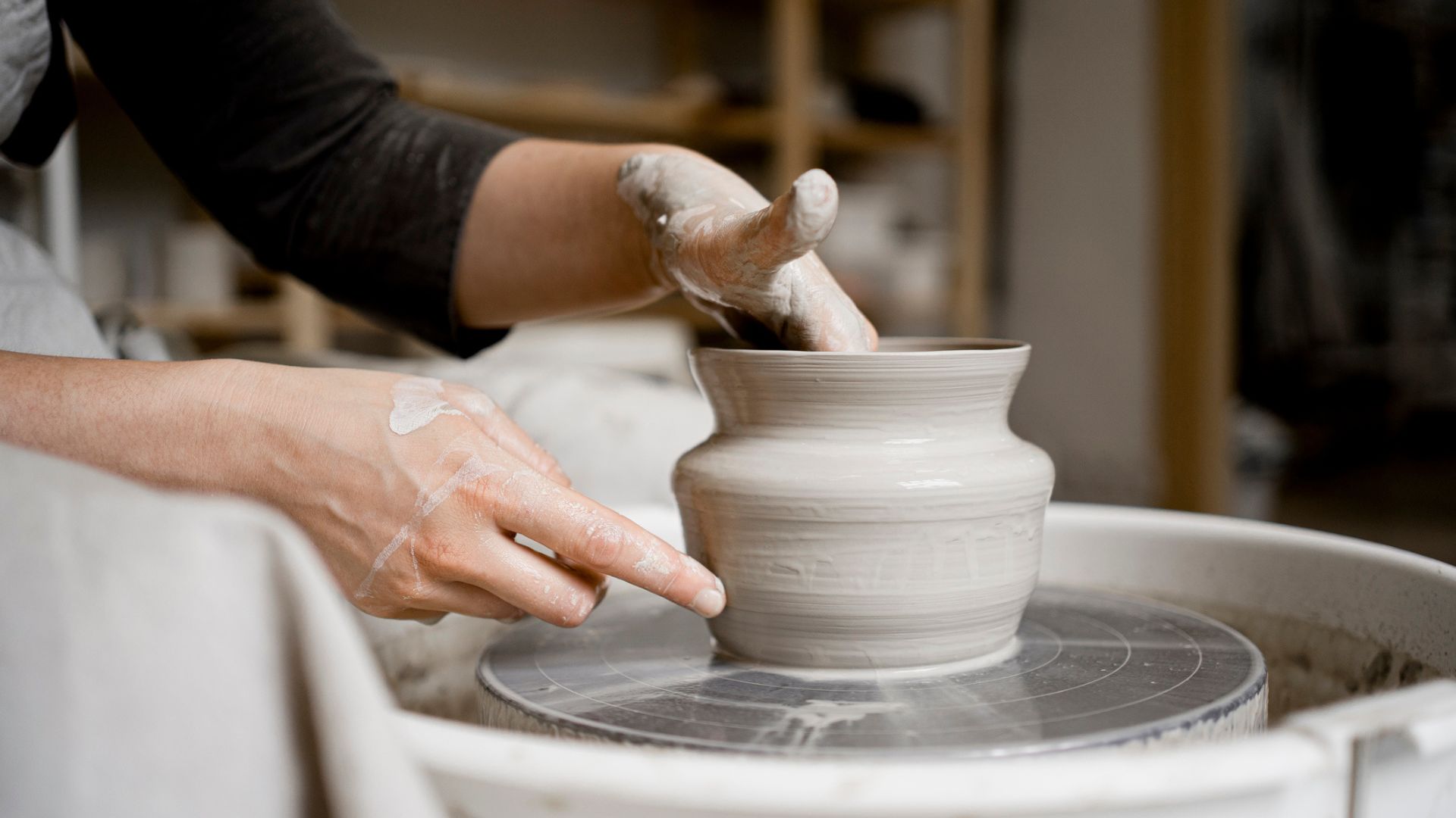 Woman using a pottery wheel