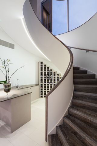 Spiral staircase leading to basement wine cellar