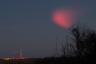 This eerie red glow in the sky was created by water vapor launched to the upper atmosphere by the U.S. Space Force sounding rocket on March 3, 2021.