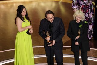 (L-R) Marilyne Scarselli, Pierre Olivier Persin and Stephanie Guillon accept the Makeup And Hairstyling award for "The Substance" onstage during the 97th Annual Oscars at Dolby Theatre on March 02, 2025 in Hollywood, California.