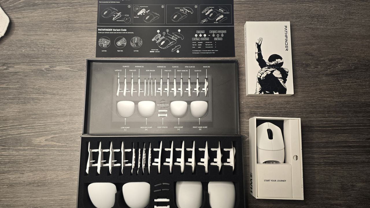 Orbital Pathfinder gaming mouse with various attachments.