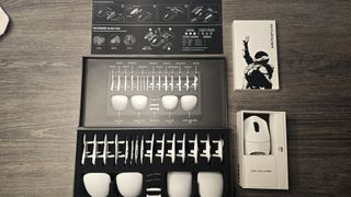 Orbital Pathfinder gaming mouse with various attachments.