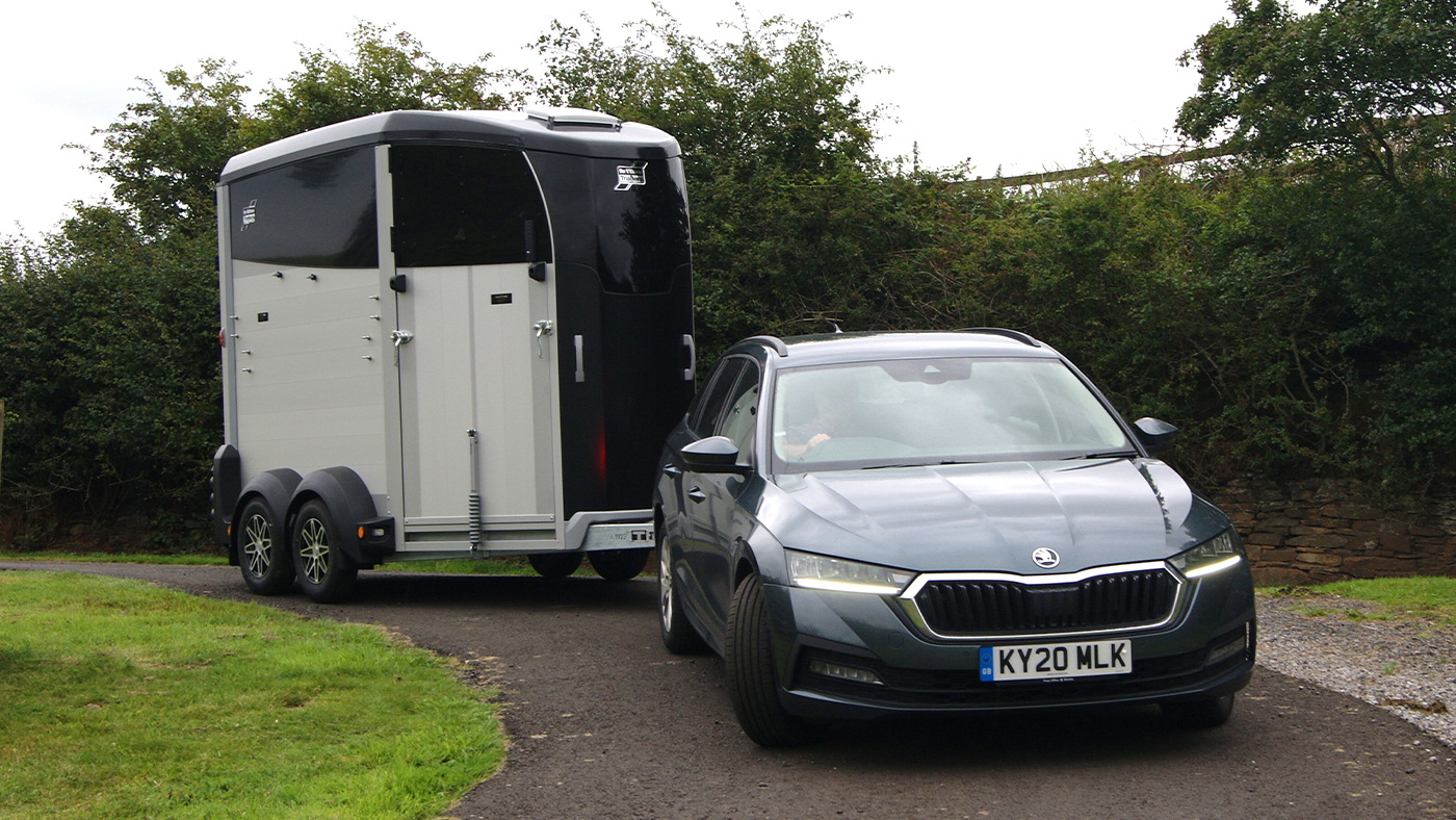Skoda Octavia car towing a horse trailer