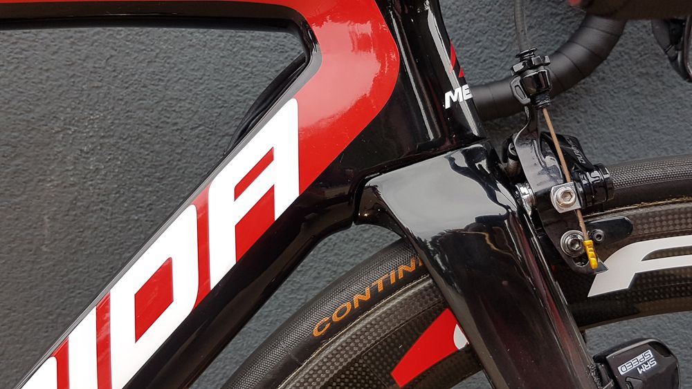 The fork crown cuts into the down tube of the frame