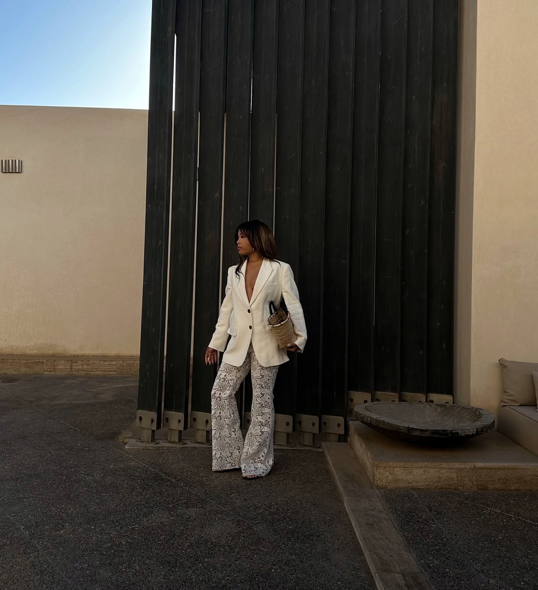 Ellie Delphine in a white blazer