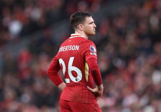 Andrew Robertson of Liverpool reacts after being shown a red card during the Premier League match between Liverpool FC and Fulham FC at Anfield on December 14, 2024 in Liverpool, England.