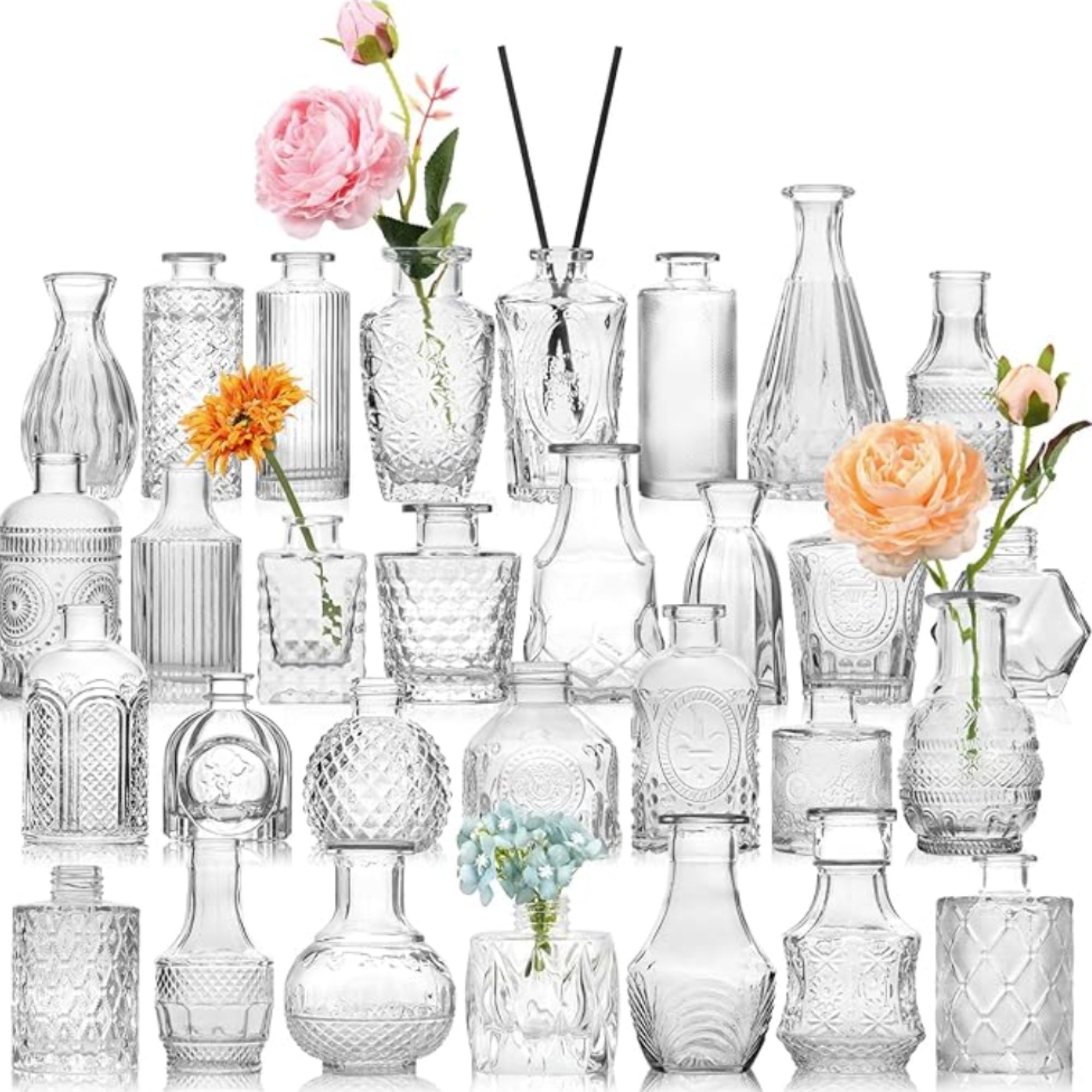 collection of clear glass etched bud vases