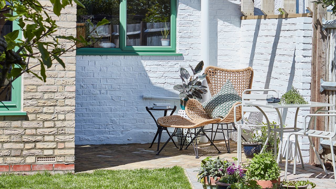 small patio area with bistro set and lounge seat