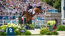 Ben Maher and Dallas Vegas Batilly on their way to helping Britain win team gold.
