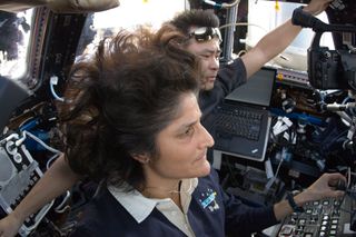 ISS Crew at the Robotics Workstation