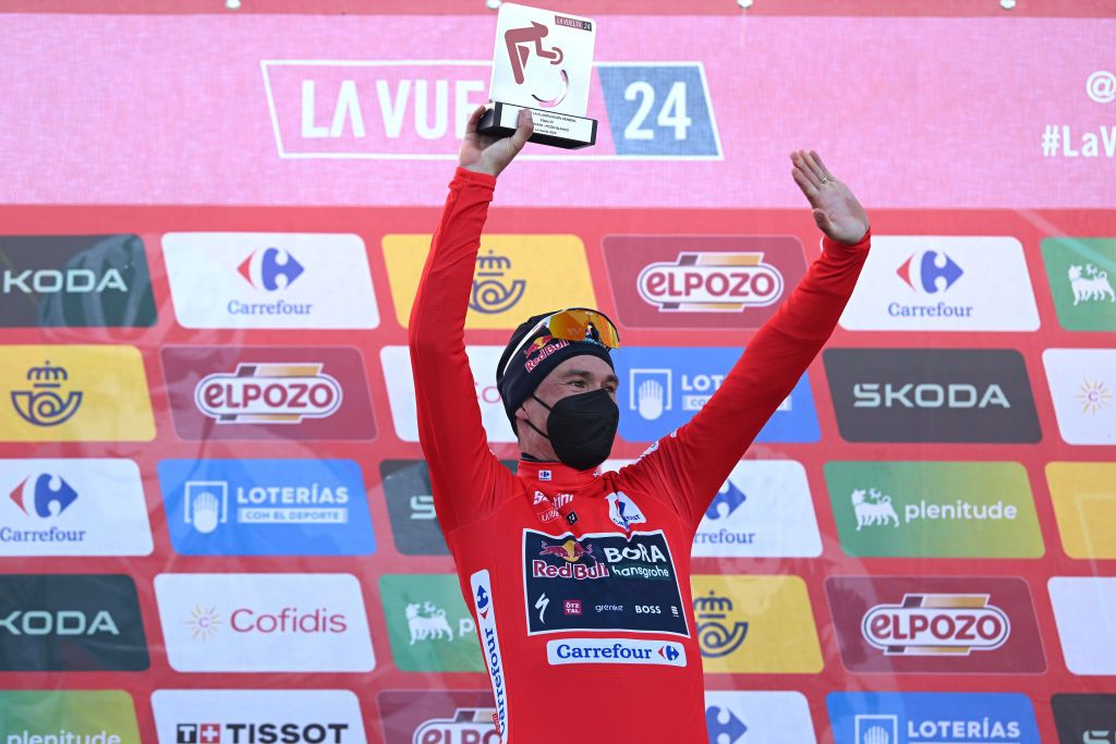 PICON BLANCO BURGOS SPAIN SEPTEMBER 07 Primoz Roglic of Slovenia and Team Red Bull Bora hansgrohe Red Leader Jersey celebrates at podium during the La Vuelta 79th Tour of Spain 2024 Stage 20 a 172km stage from Villarcayo to Picon Blanco 1491m UCIWT on September 07 2024 in Picon Blanco Burgos Spain Photo by Dario BelingheriGetty Images