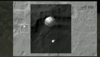 NASA's Mars Reconnaissance Orbiter snapped this amazing view of the Mars rover Curiosity as it descended to Mars under its landing parachute on Aug. 5, 2012.