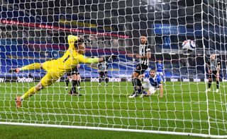 Neal Maupay scores the third goal in Newcastle's 3-0 loss to Brighton (Mike Hewitt/PA).