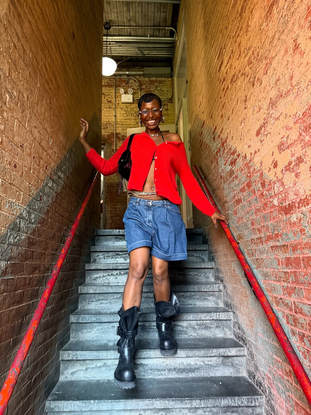 woman wearing bermuda shorts with boots outfit 2025