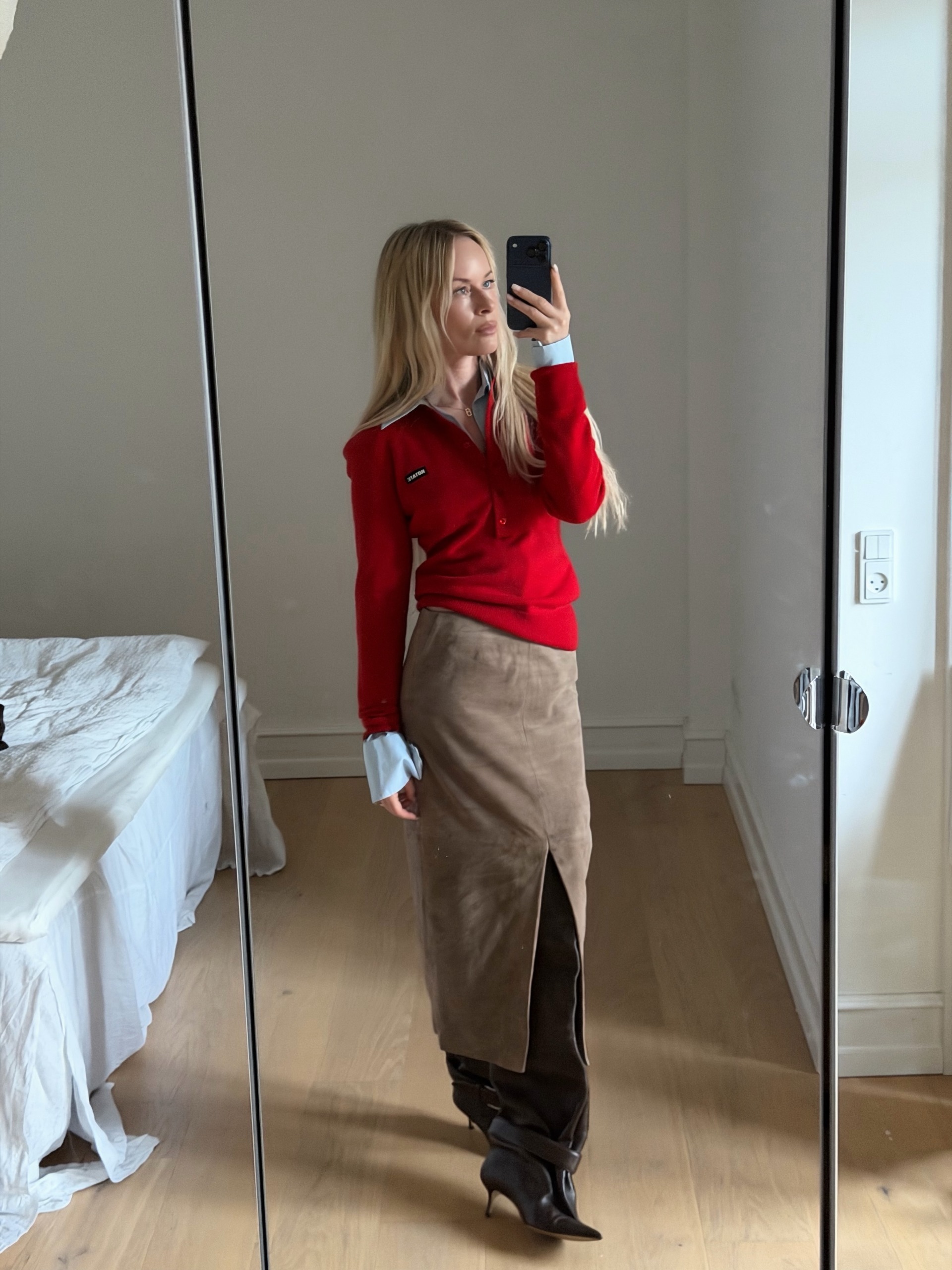 An image of a woman wearing skirt with slits outfit fall 2026