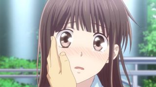 Tohru Honda with a hand on her face in Fruits Basket