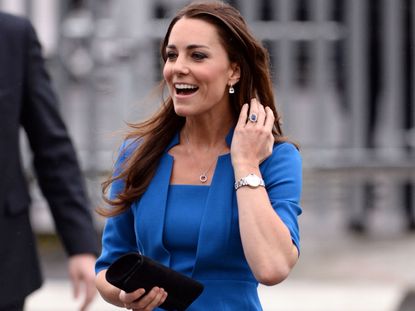 Kate Middleton wears a blue LK Bennett dress.