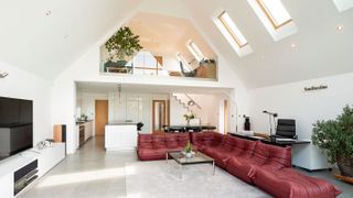 open plan living room and kitchen with mezzanine level above