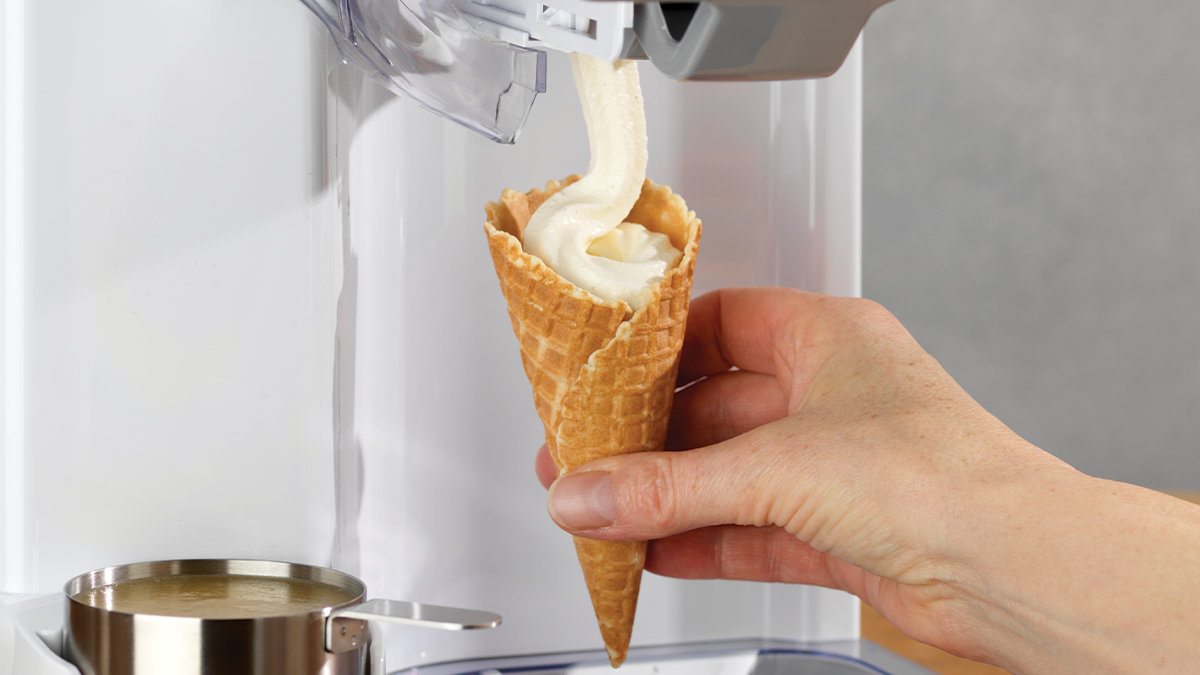 Cuisinart Soft Serve Ice Cream Maker dispensing ice cream into a cone