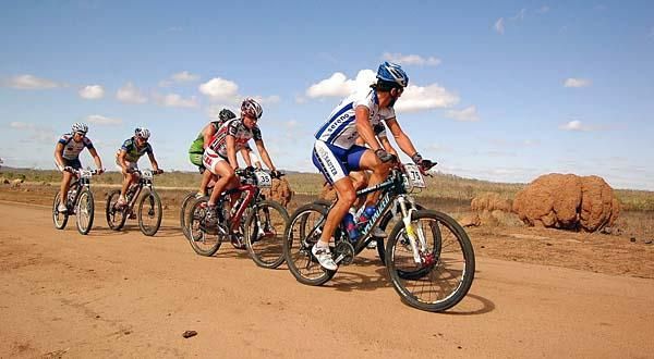 Riders pass through the valley of the termite mounds.