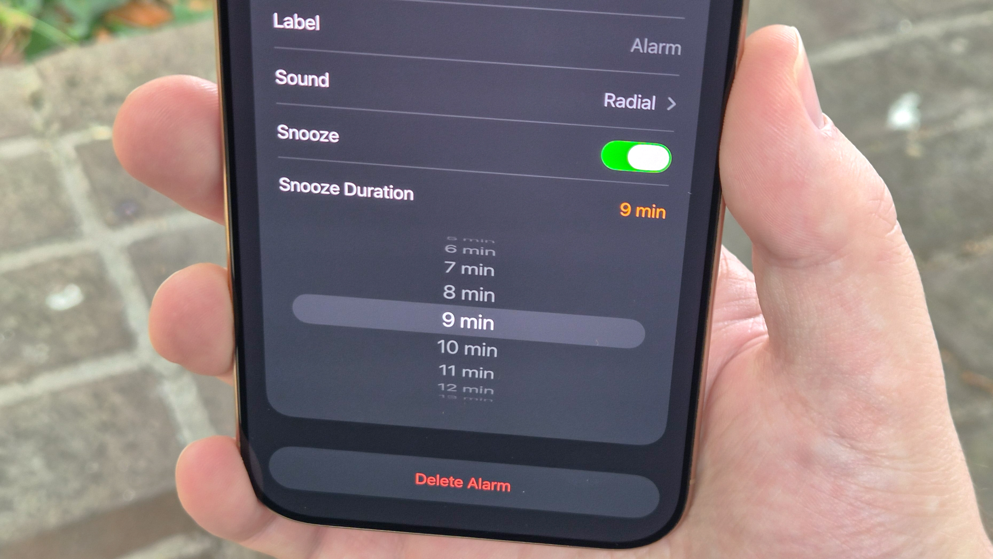 Photo of iOS 26 Clock app with wheel of snooze options