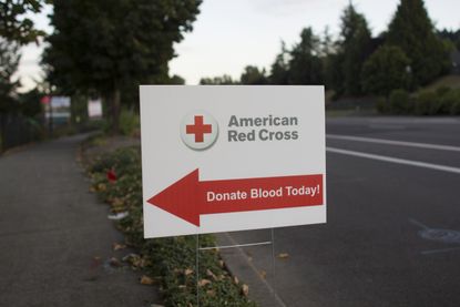 A sign urging people to donate blood.