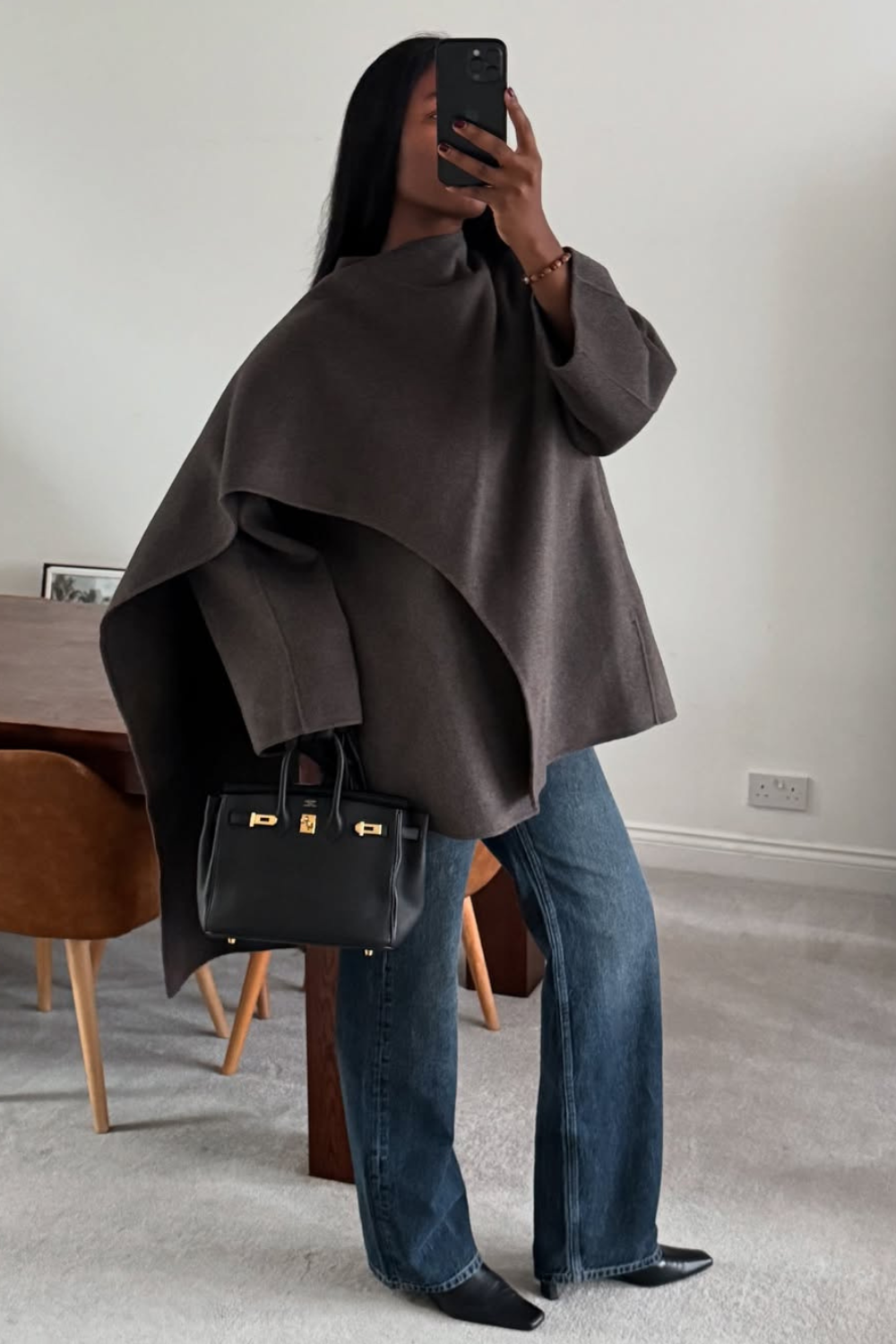 @nlmarilyn wears jeans and grey coat