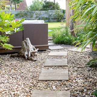 gravel garden path with wooden decking squares